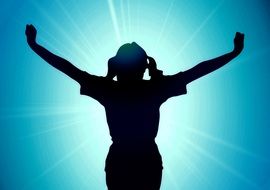 silhouette of a happy woman on a background of sun shine