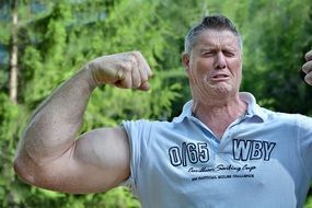 portrait of a muscular man in nature