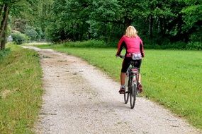 cycling female on a cycle path