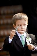 boy blowing soap bubbles