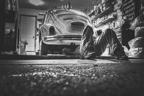 mechanic man under car