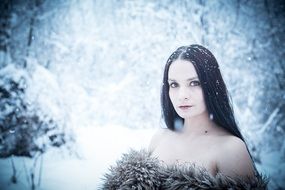 glamour lady in the winter forest