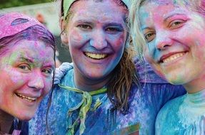 three smiling girls with painted faces