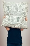 pillow with newspaper pattern