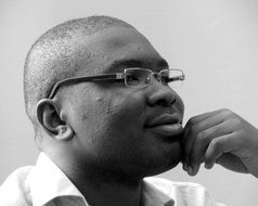 thinking african man in glasses
