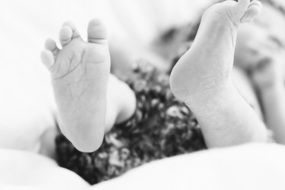 cute baby feet monochrome photo