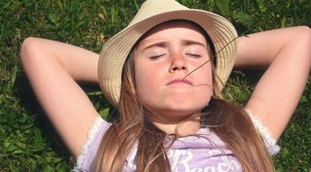 a child laying in the meadow