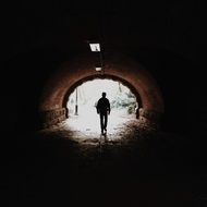 Man walking in a tunnel