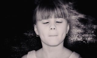 portrait of a squinting girl
