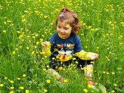 child girl in the beautiful and colorful mid-summer meadow