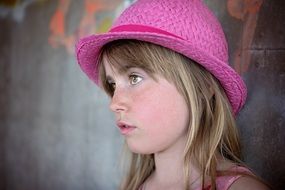 The look of a girl in a pink hat