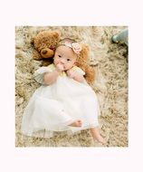 little girl in a white smart dress