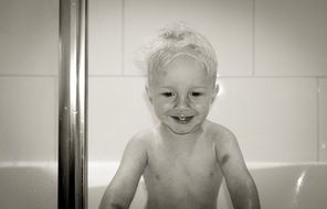 black-and-white photo of the baby in the bath