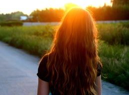 bright sunset over a girl with long hair