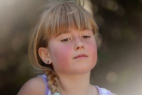 young girl with pink cheeks
