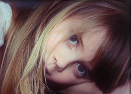 child girl with a sad look