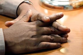 men's hands on the table