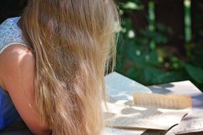 young girl reading letters