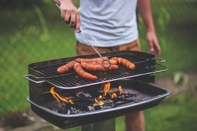 grilling of sausages