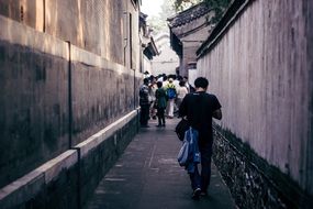 people walking on narrow street, china, beijing