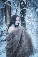 glamour lady in winter forest