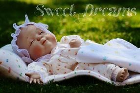 Charming doll with closed eyes like a small child