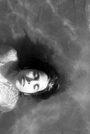 black and white portrait of a girl in the water
