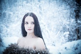 glamour lady in winter forest