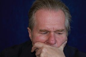brooding senior man