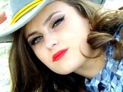 cowgirl with a hat on his head