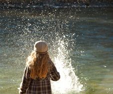 girl playing with water