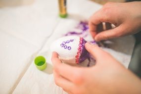 painted easter egg in child's hand