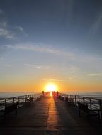 sunset at the end of the pier