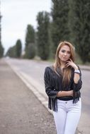 portrait of beauty girl standing on a sidewalk