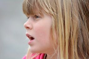 blond girl portrait from the side