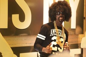 rap star in gold jewelry
