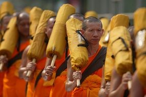 Buddhist monks in orange robes in thailand