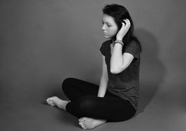 sad girl sits on floor