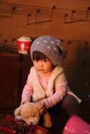 asian child girl with soft toy indoor