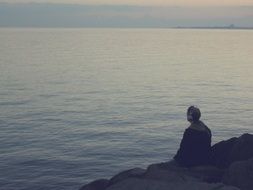 guy is relaxing on a calm beach