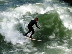 surfer rides a big wave