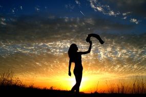 photo of the girl silhouette at the sunset