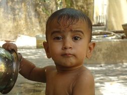 infant sweet boy in the bath