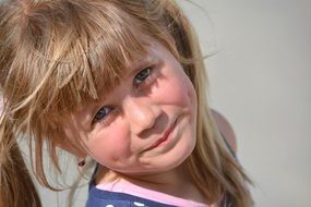 blonde girl is posing in the photo
