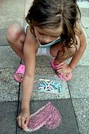 Portrait of girl painting on a road