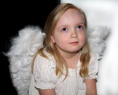 little girl in angel costume