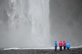 people near a waterfall in spain
