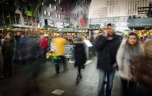 blurred photo of a crowd of people in a shopping mall