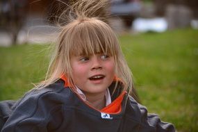 girl blond hair windy weather
