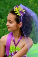 Summer girl with hair decorated with flowers